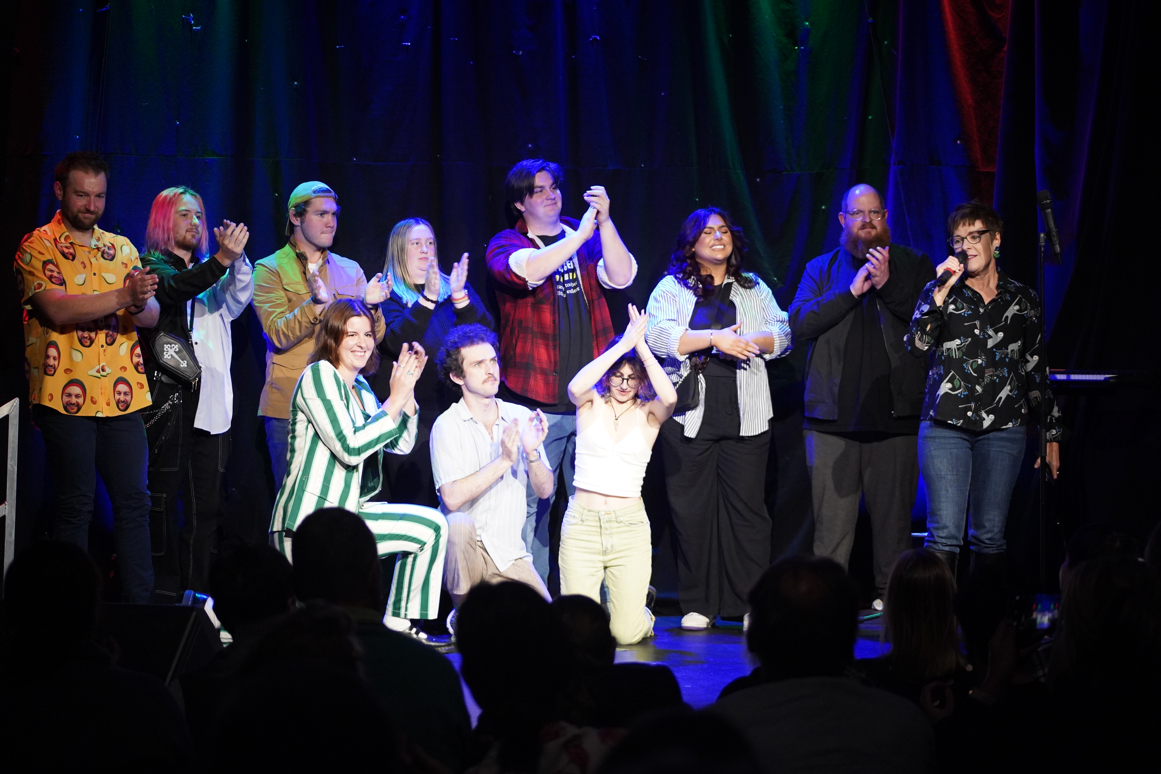 Group of Collarts comedy students on stage clapping at the end of their show at the Melbourne International Comedy Festival