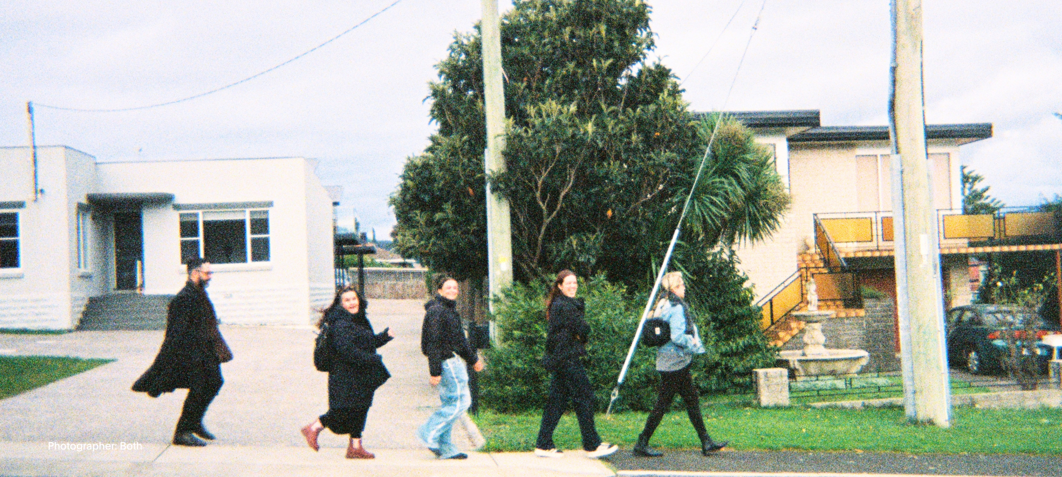 4 Students and 1 teacher walking along the streets of Tasmania