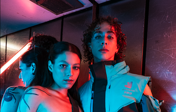 Close up of two fashion models standing together in an elevator
